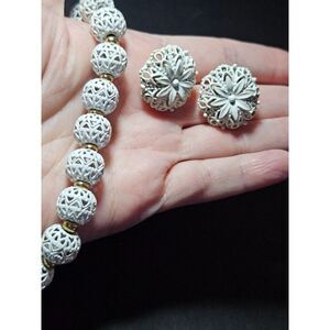 Monet vintage gold tone and white necklace and earring set